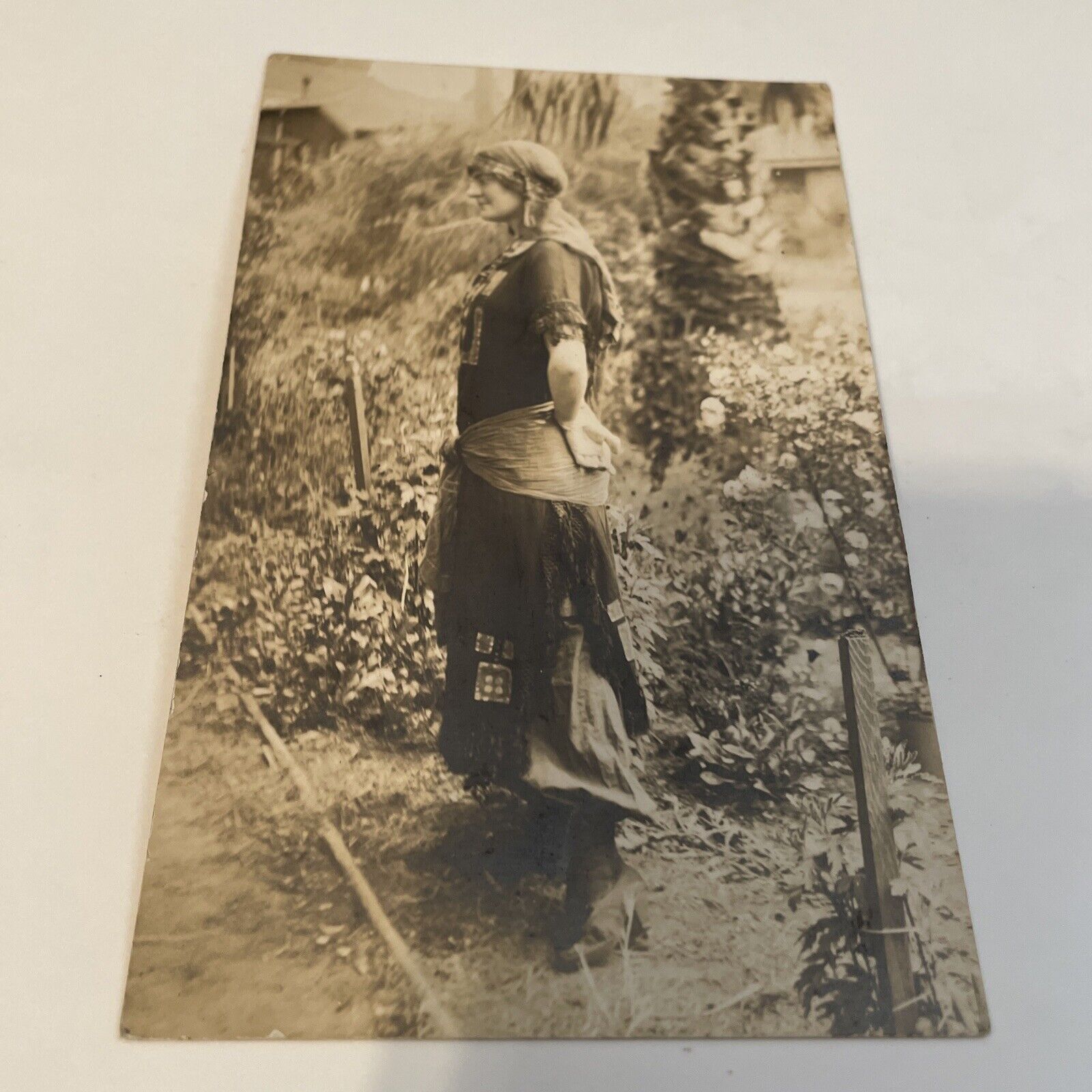 RPPC YOUNG LADY DRESSED LIKE A GYPSIE IN Backyard, early 1918 not posted