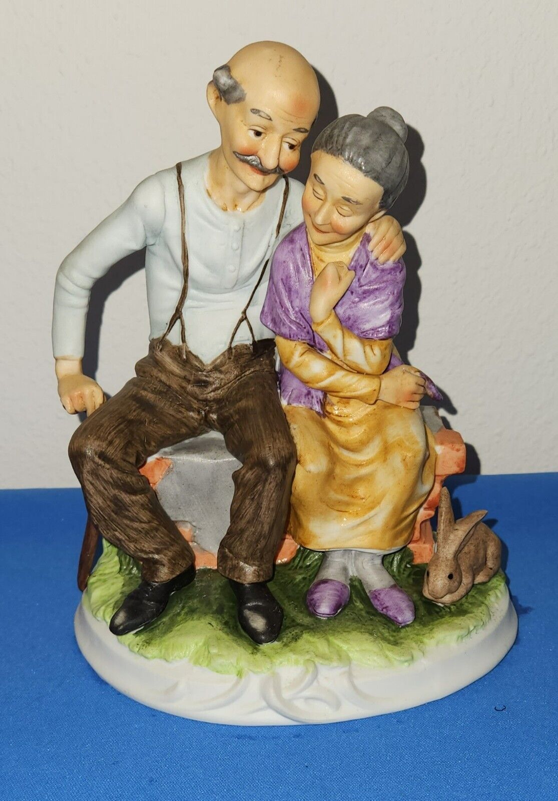 Loving Older Couple Hugging Figure. Man With Cane & Woman With Rabbit, Love