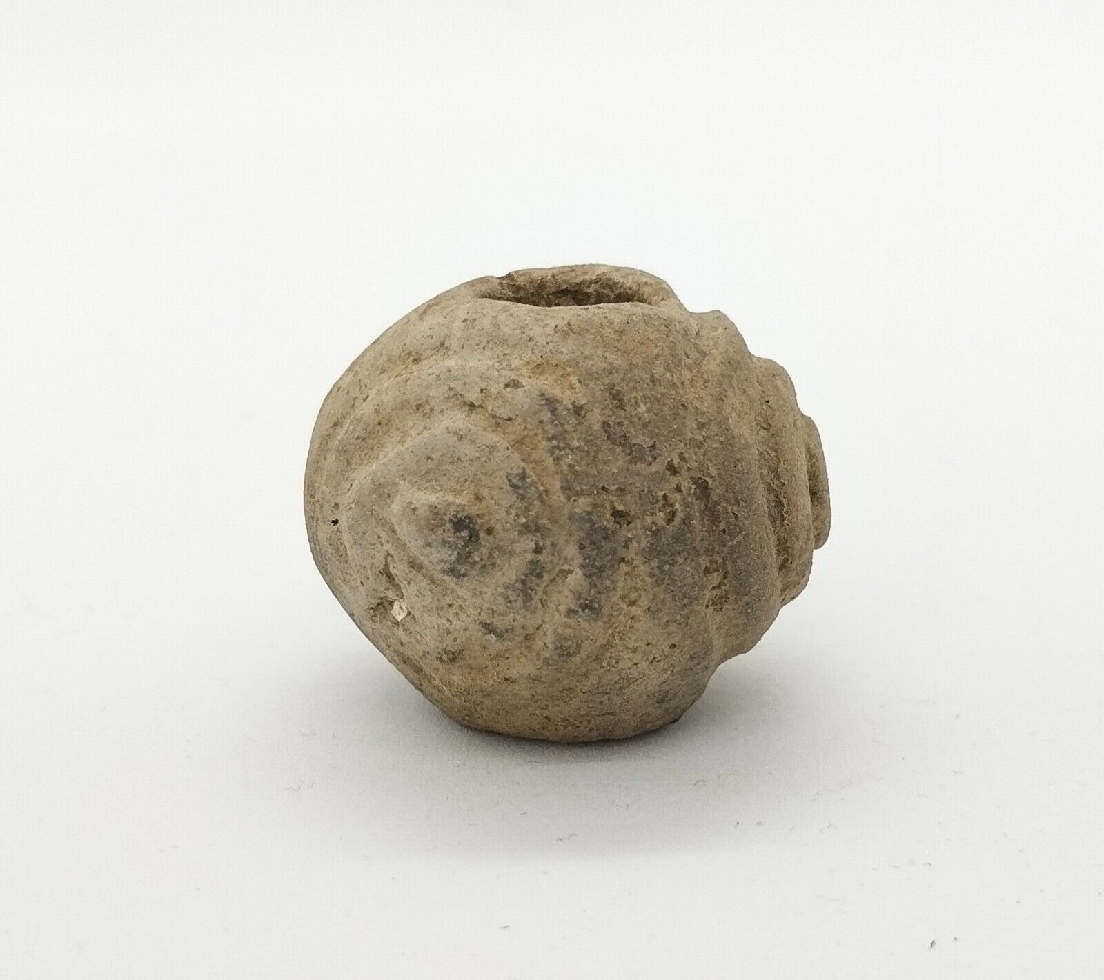 Ancient сlay bead with ornaments and graffiti of Viking age, spinning wheel