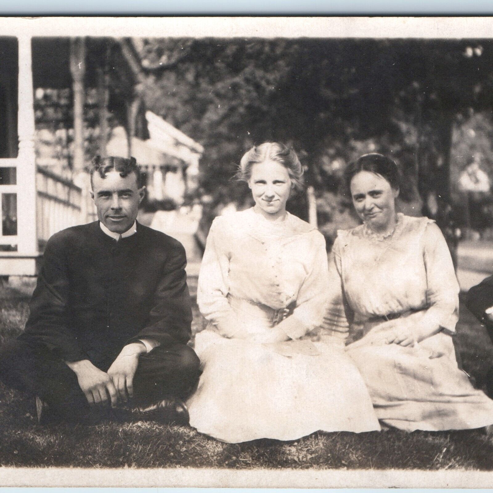 c1910s Group Outdoors in Lawn RPPC Women Man Weird Hairdo Houses Real Photo A261