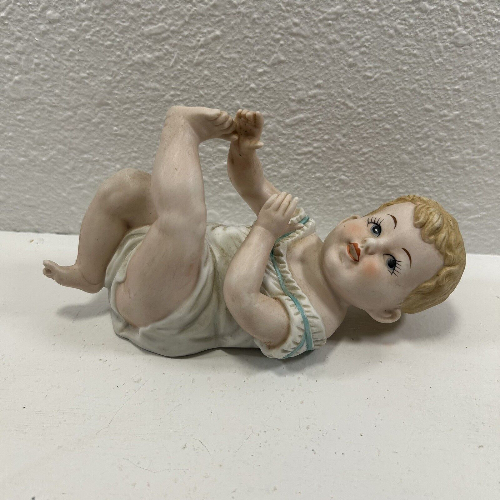 8 in Vintage Bisque Porcelain Piano Baby Boy Figurine Lying Down by Andrea 7536