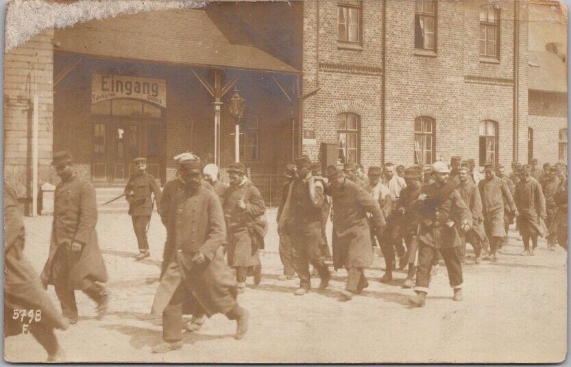 c1910s WWI Photo RPPC Postcard German Soldiers with Prisoners / Street Scene
