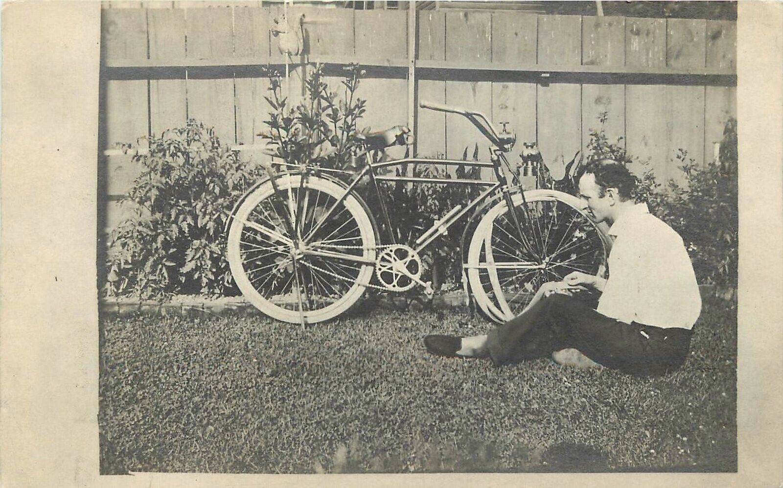 Postcard RPPC Bicycle man changing tire C-1910 23-1425