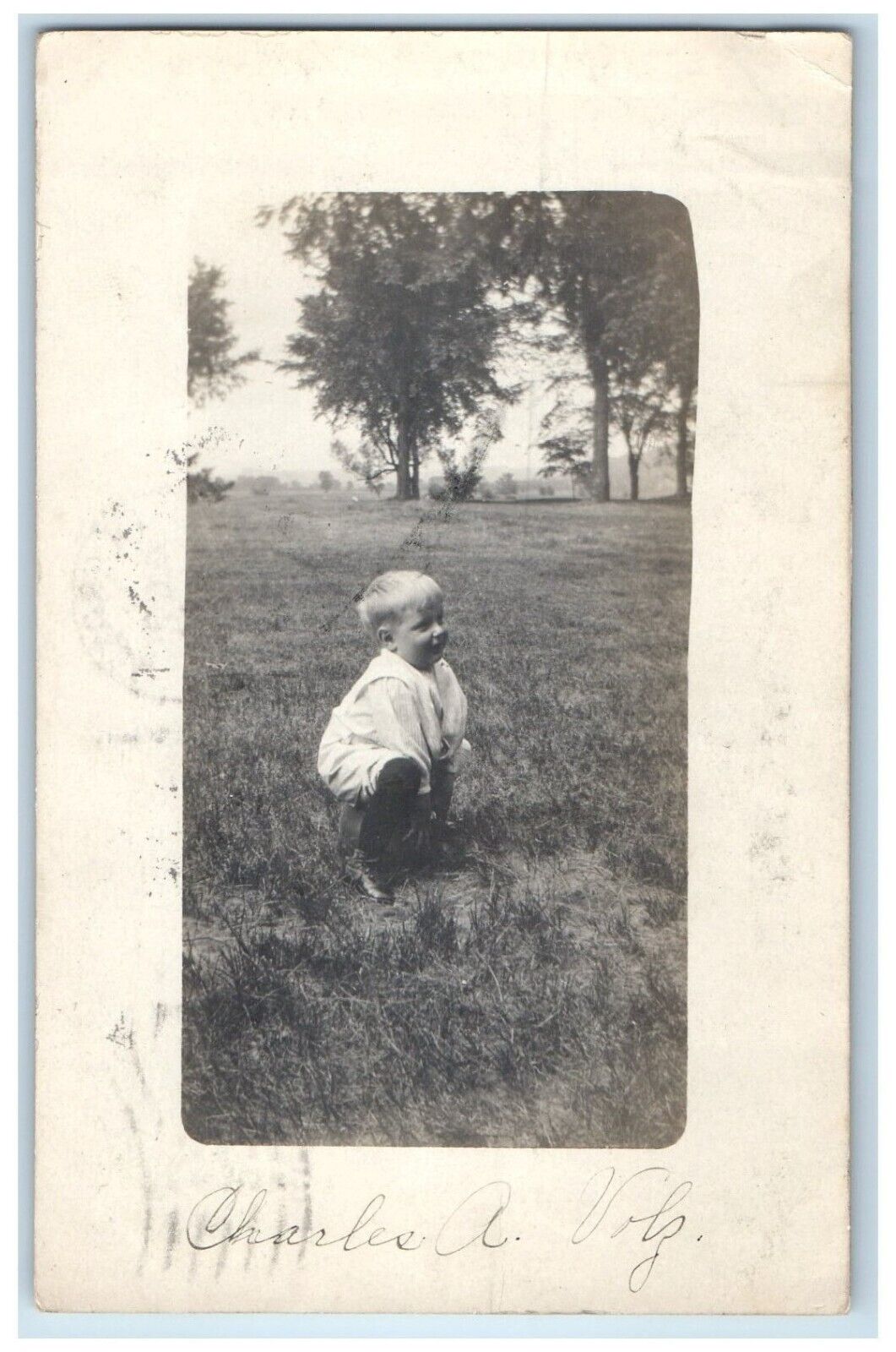 1909 Little Boy On The Grass La Crosse Wisconsin WI RPPC Photo Antique Postcard