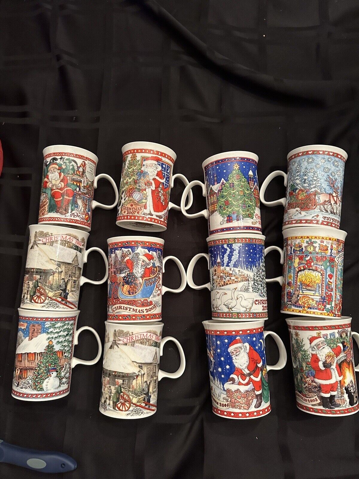 dunoon mugs bone china Set Of 12 Christmas From 1994-2010 Used Once