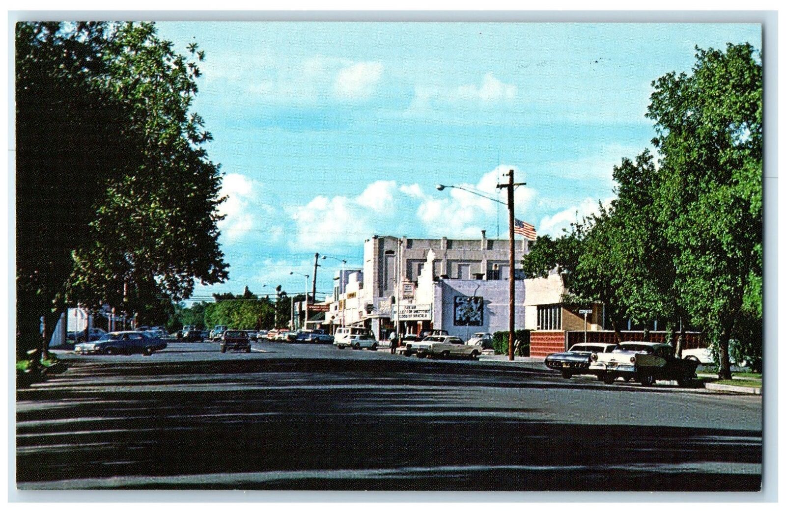 c1960\'s Downtown Flags Shops Cars Buildings Scene Orlando California CA Postcard