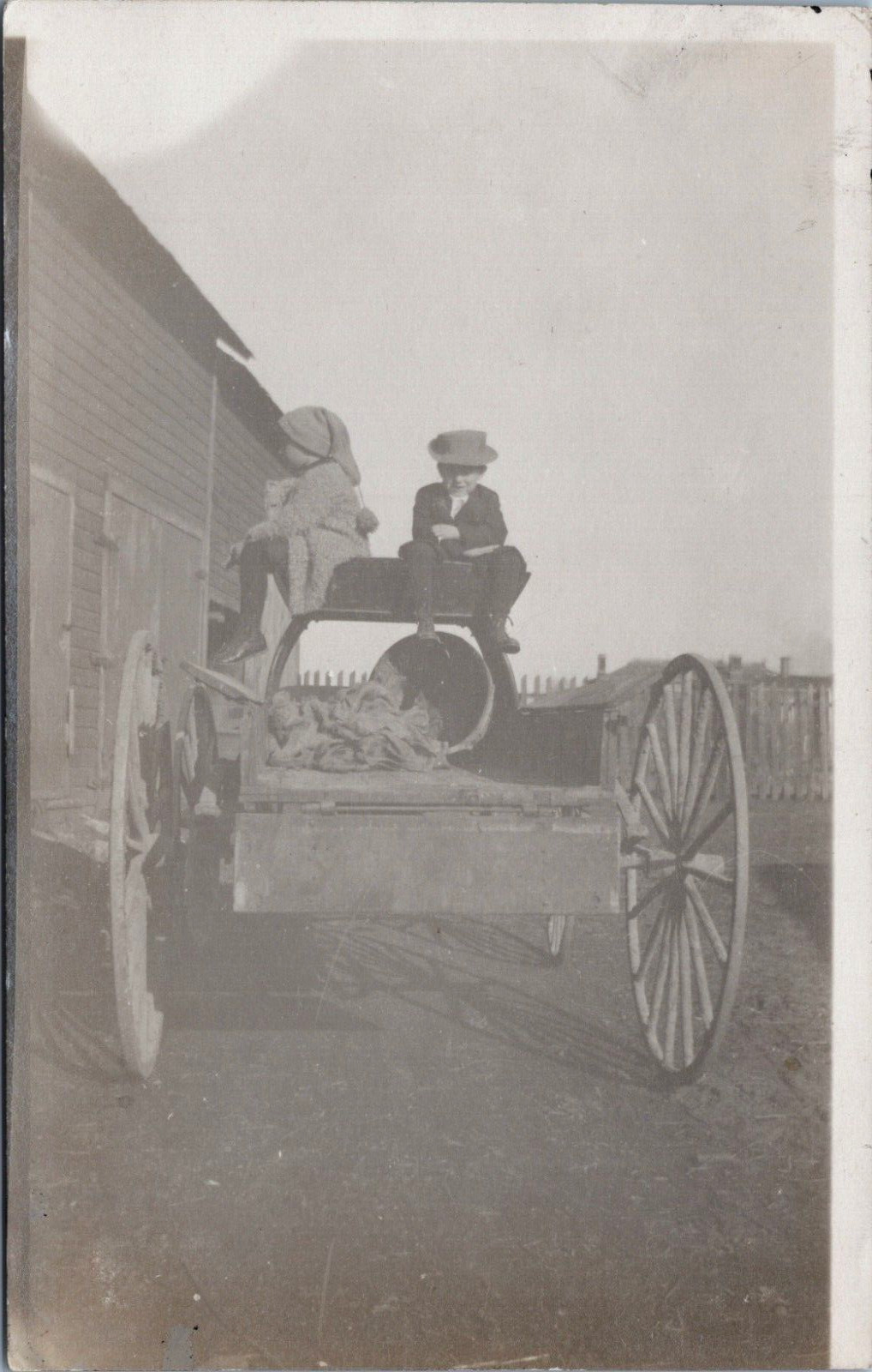 RPPC Marion Ohio 1912 Boy Girl Hats Sitting on Wagon Next to Barn Farm OH