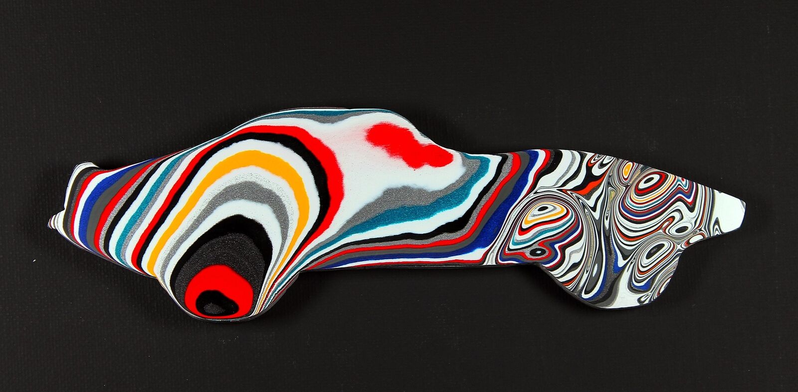 Finished Piece of Fordite - Shape of a Corvette - Finished Both Sides - 188.00m