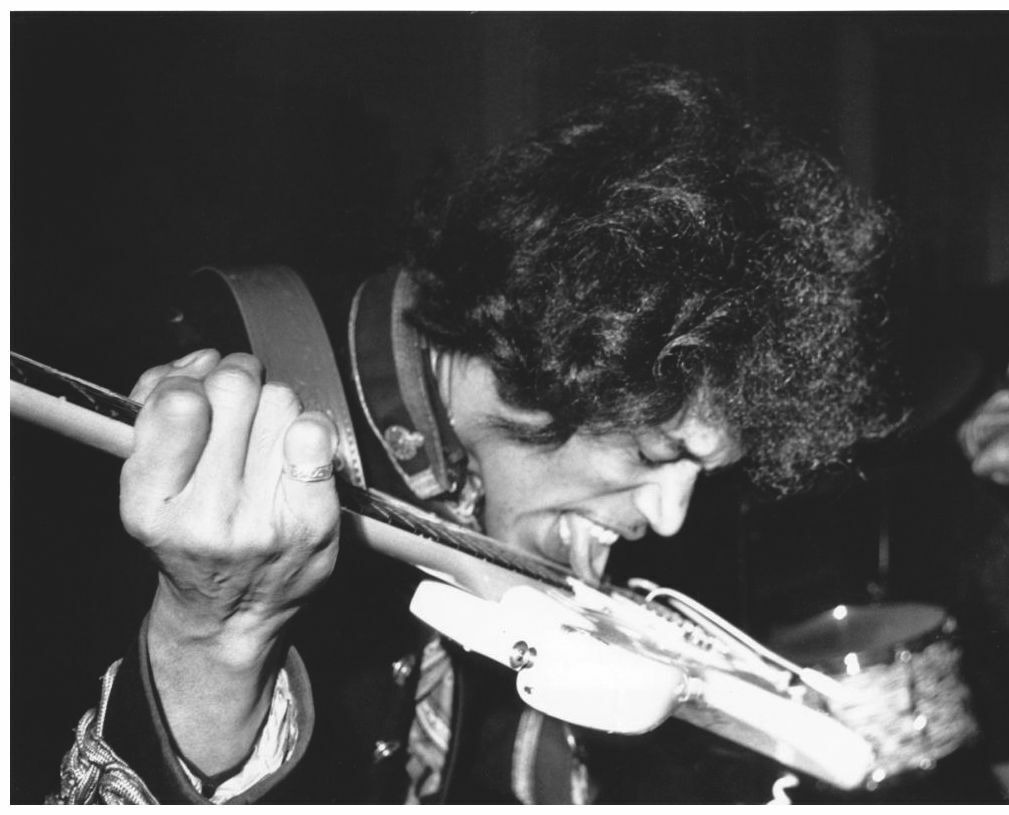 Rock Musician Jimi Hendrix Plays Guitar with Tongue Photo 8