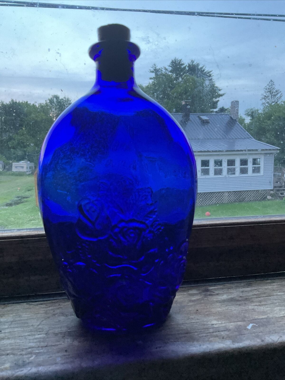 antique floral embossed flask with cork cobalt blue