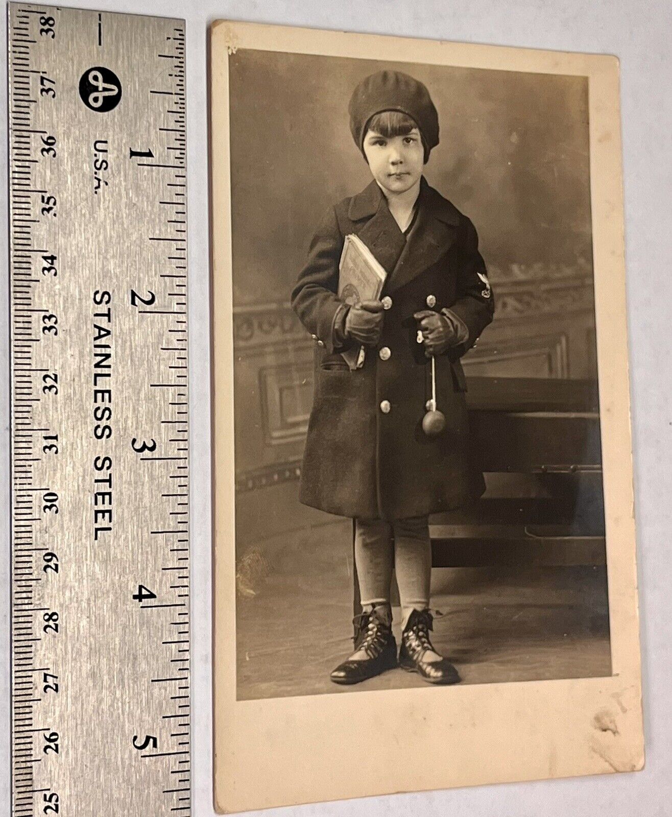 Vintage Postcard. Little Girl In Dress Coat Holding School Book. 1915-1930