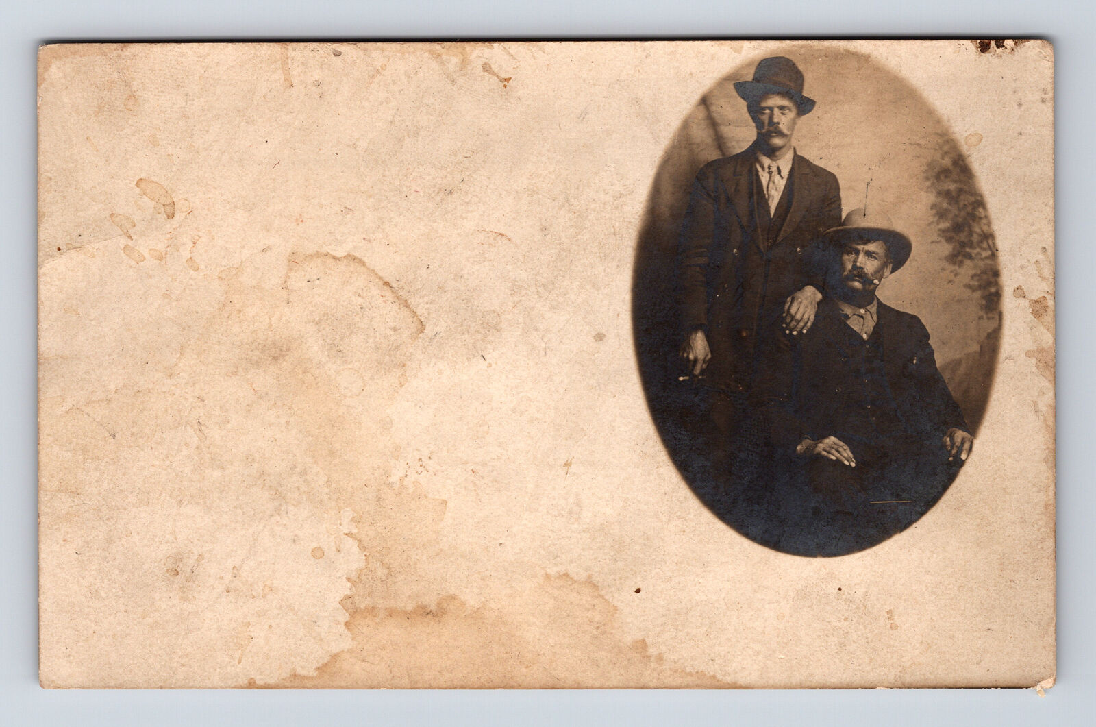 RPPC Cameo Portrait of Two Men Mustaches Cigars Heavy Marking Postcard