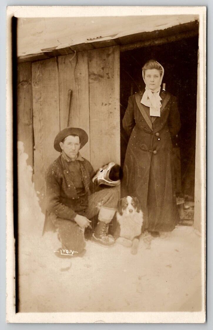 RPPC Michigan Man Holding Skull Woman Wood Shed And Cute Dog Postcard S27