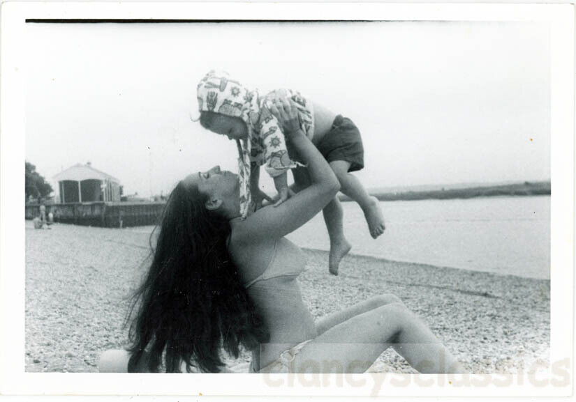 1968 Hippie Young Woman in Bikini Long Hair Beach Baby Goes up