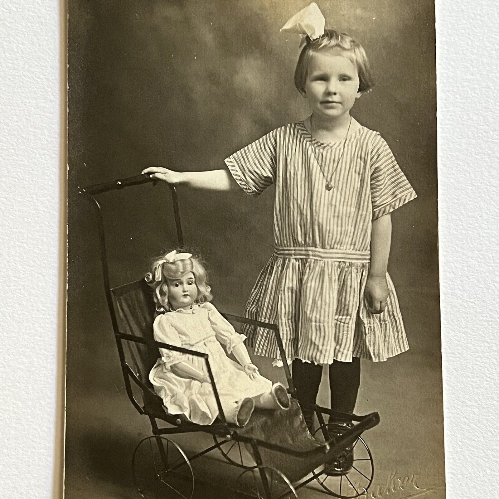 Antique RPPC Real Photograph Postcard Girl With Beloved Doll Curly Hair Delta OH