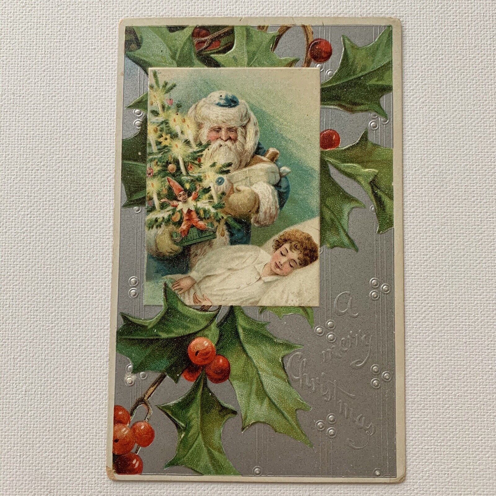 Antique Embossed Postcard Santa Green Robe Bringing Tree Elf Toys For Boy