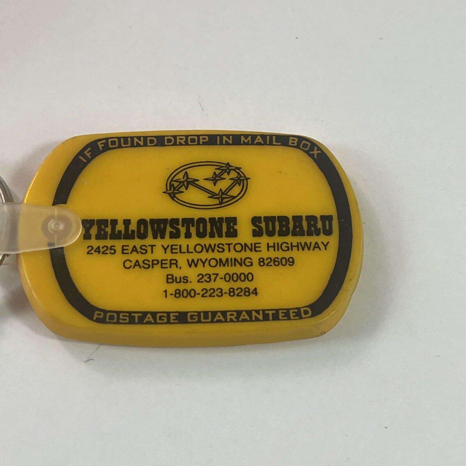 Vintage Yellowstone Subaru Casper Wyoming Postage Return Keychain Advertisement