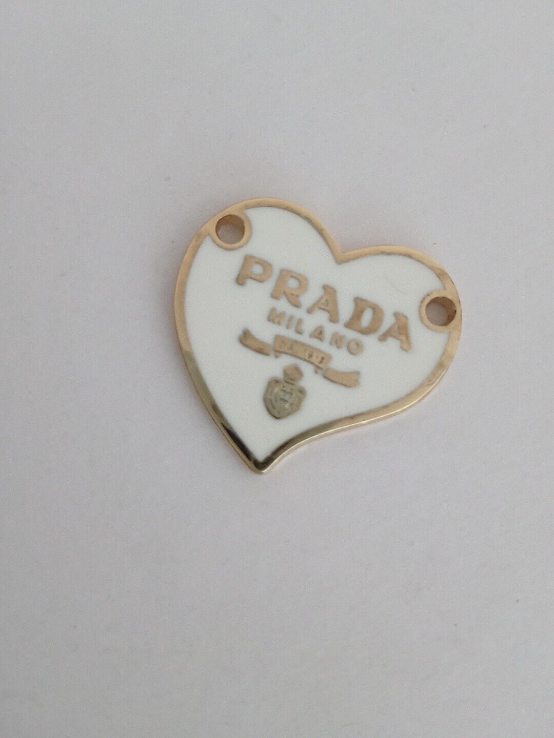 One   24mmPrada Logo Heart   with trim  Gold tone Button  Zipperpull