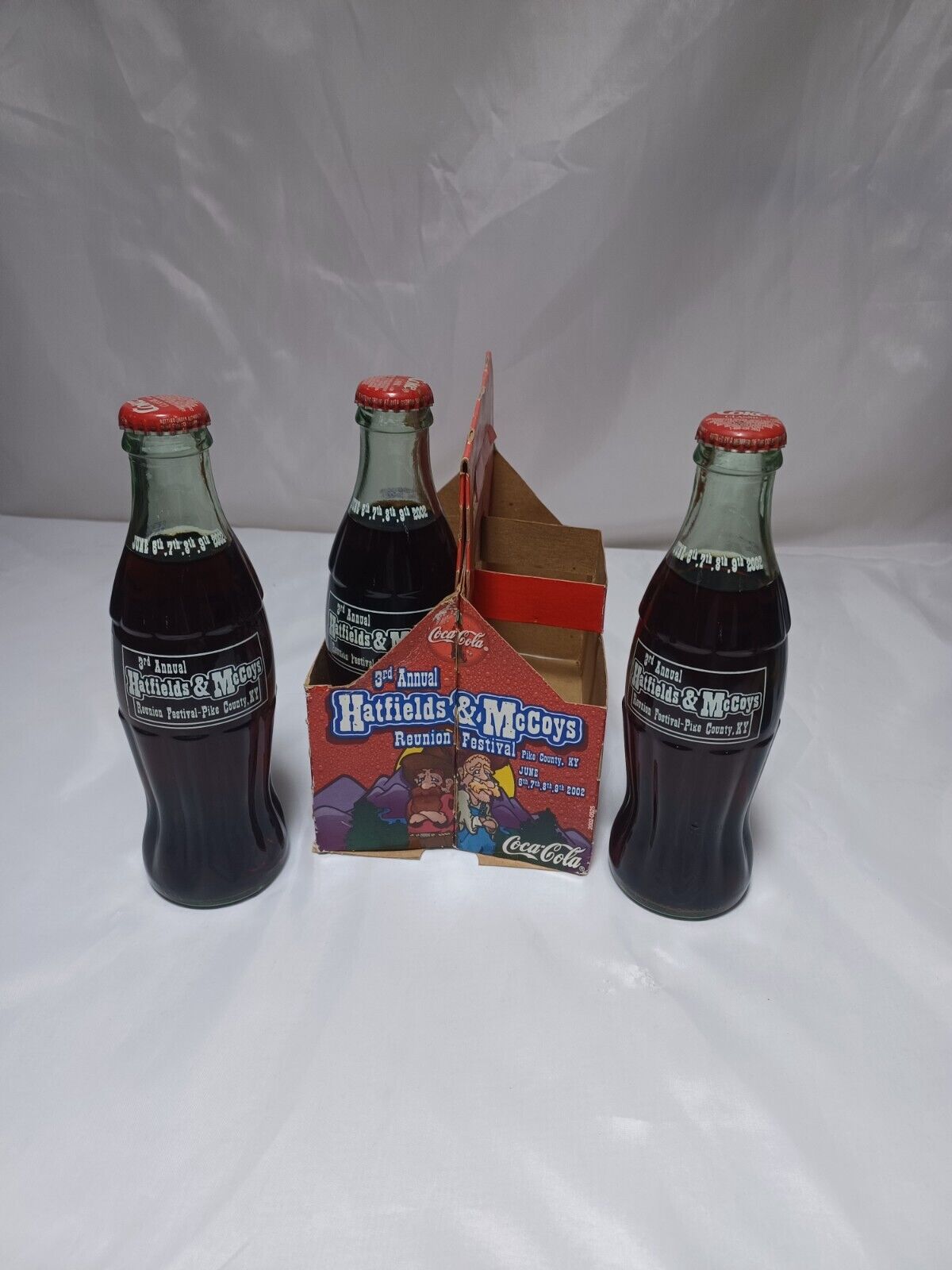 3-Vintage 8oz bottles Coca-Cola unopened Hatfields & McCoys 3rd annual Reunion