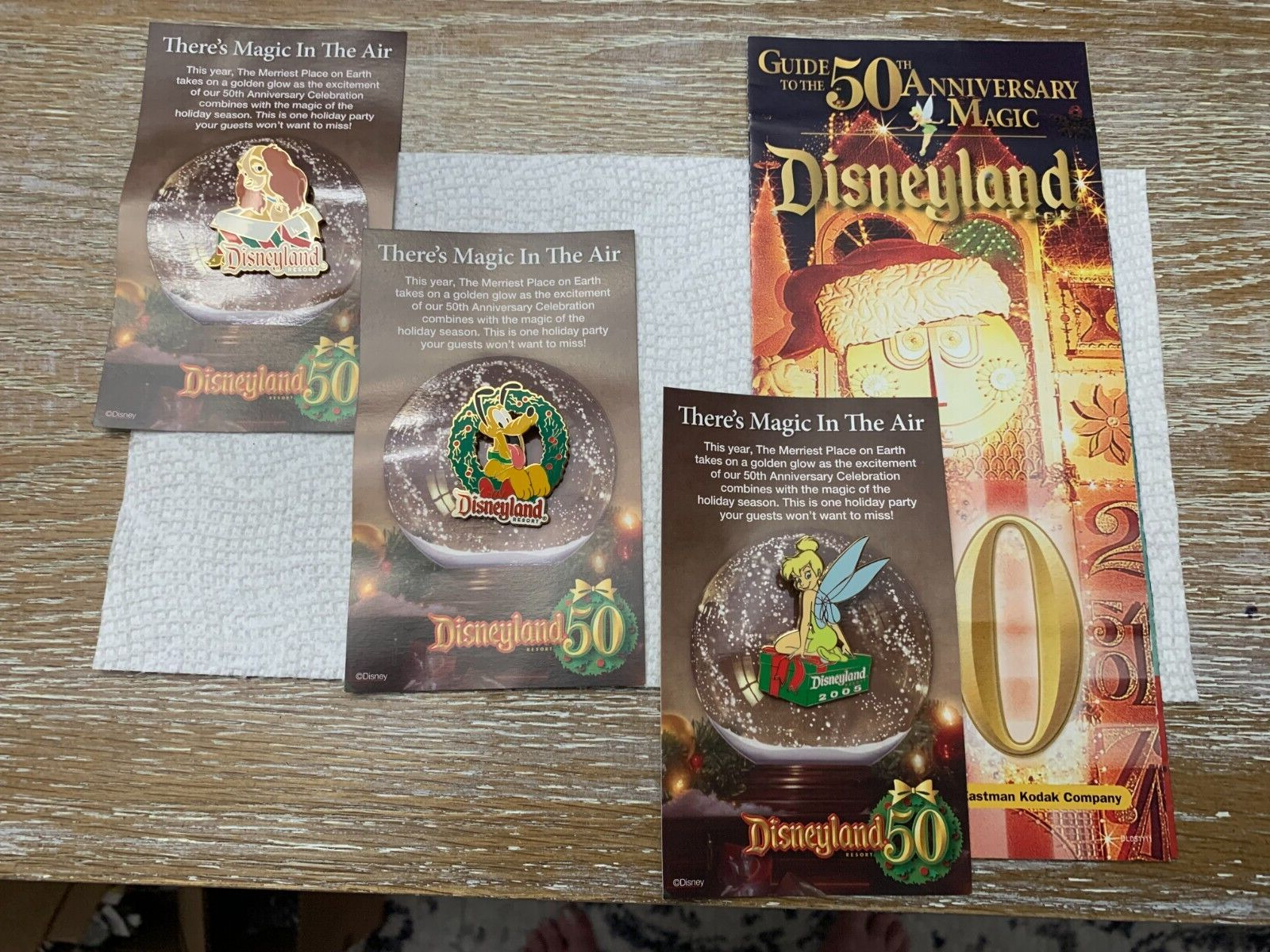 2005 Disneyland 50th Anniversary Christmas Lady Pluto Tinkerbell pins Guide Map