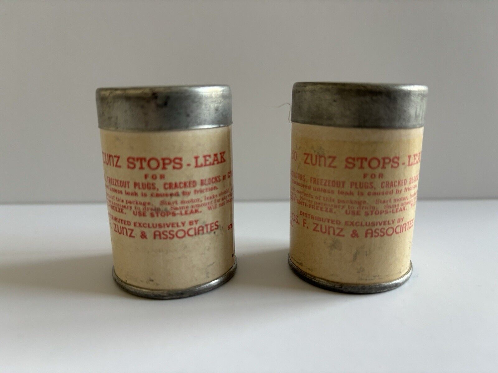 2 Vintage Trial Size Advertising Cans of ZUNZ Stops Leaks 2” Tall St. Louis MO