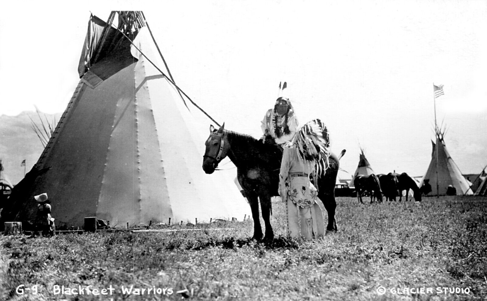 Postcard Shelby, Montana Blackfeet Warriors Indians Teepee RPPC Reprint #77588