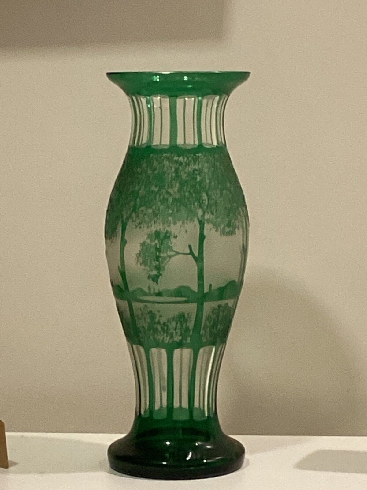 GREEN ART GLASS VASE. FACETED. CZECH. 14 IN HEIGHT. LANDSCAPE. CUT TO CLEAR.