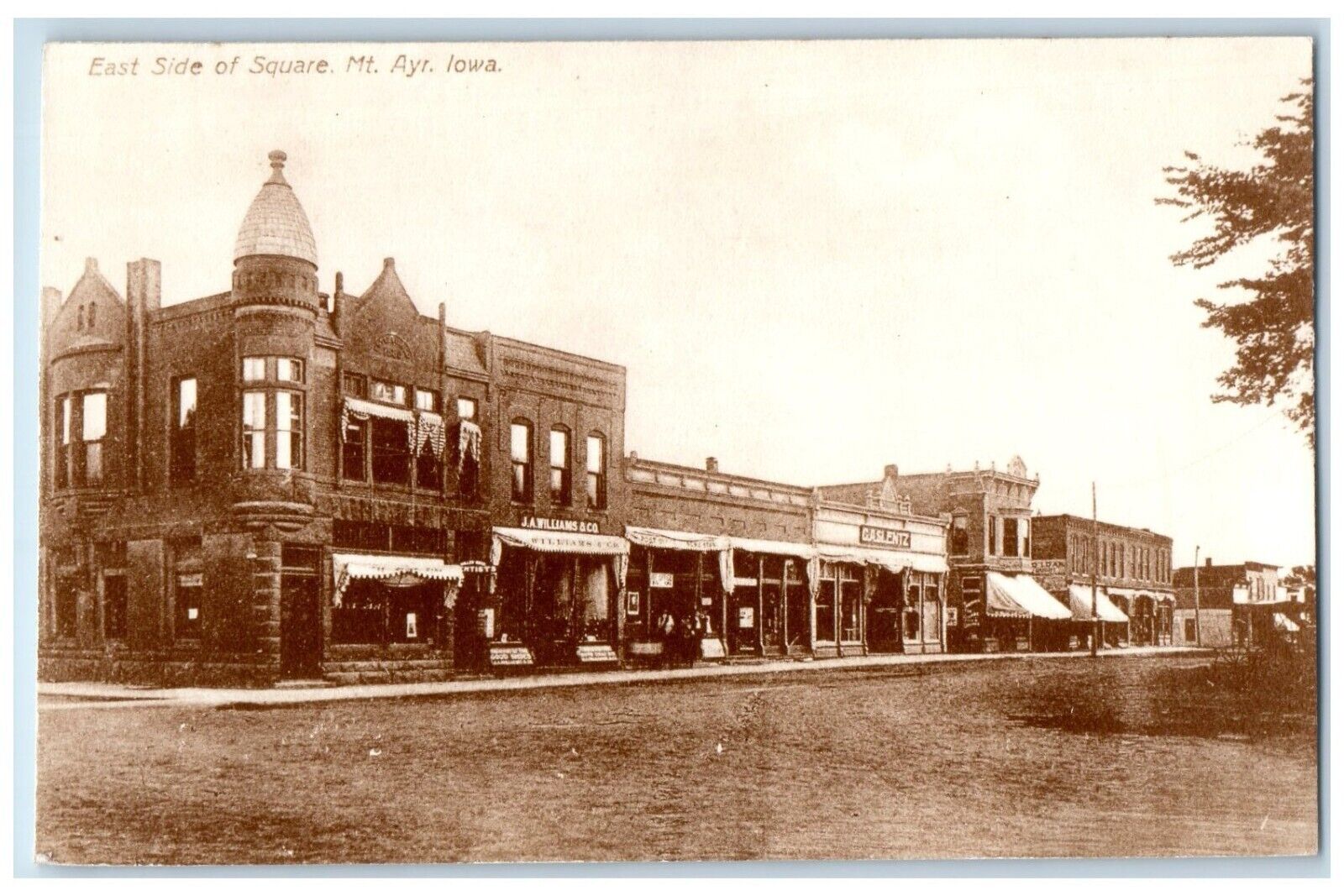 c1950 East Side Square Exterior Store Building Mount Ayr. Iowa Vintage Postcard