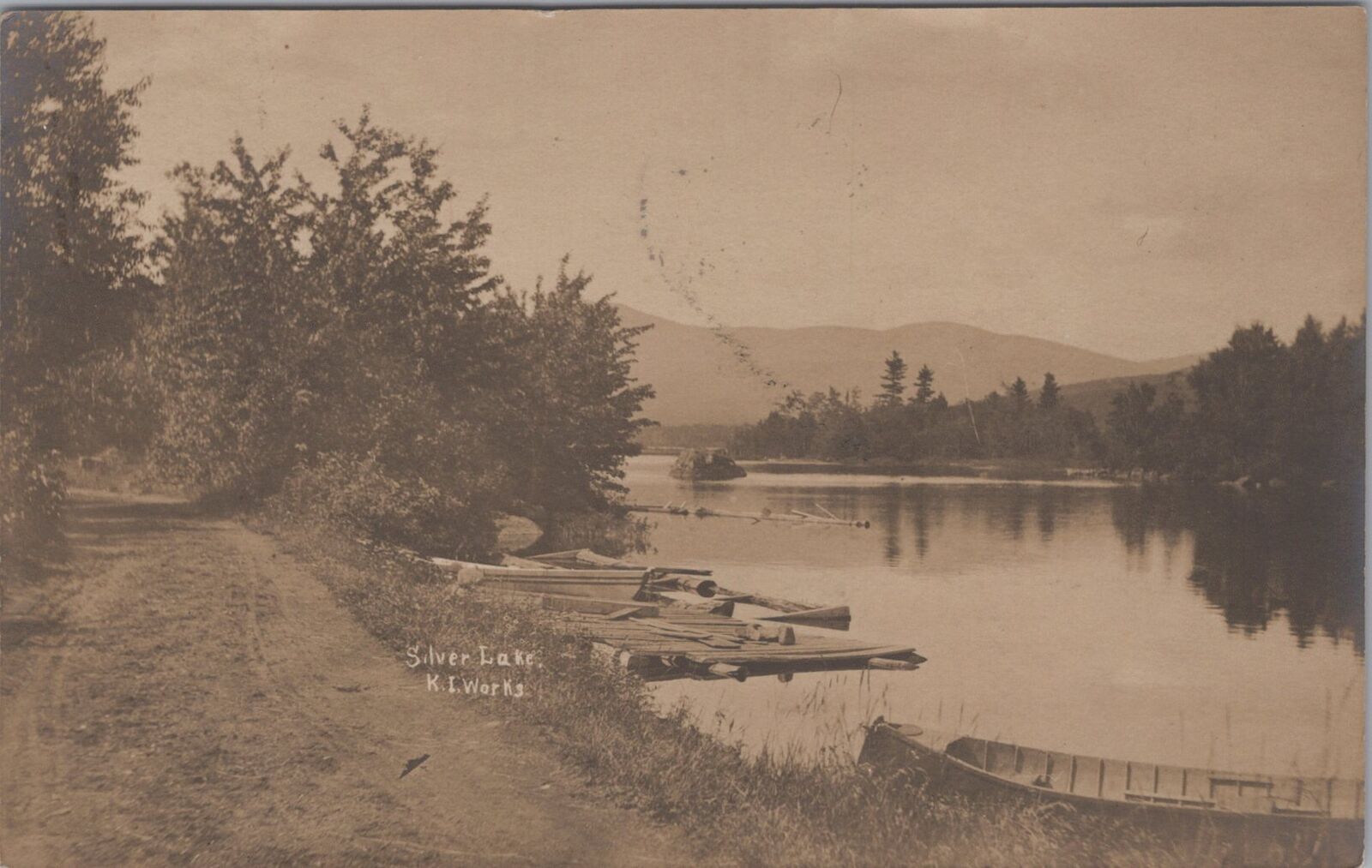 Silver Lake K.I. Katahdin Iron Works Dirt Road Logs Boat 1907 RPPC Postcard