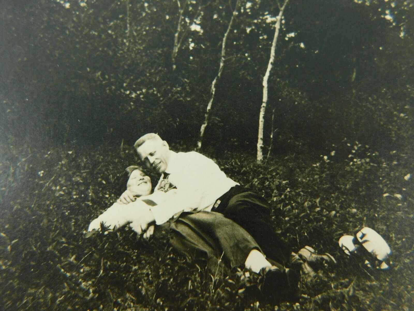 Romantic Older Couple Smiling Laying In Field Posed Real Photo Vintage Postcard