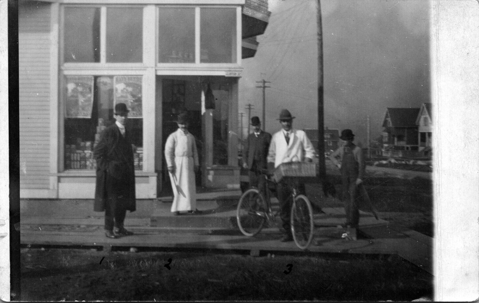 RPPC Store Street Scene 3 Men named on back Butcher Knife Delivery Bicycle 1912