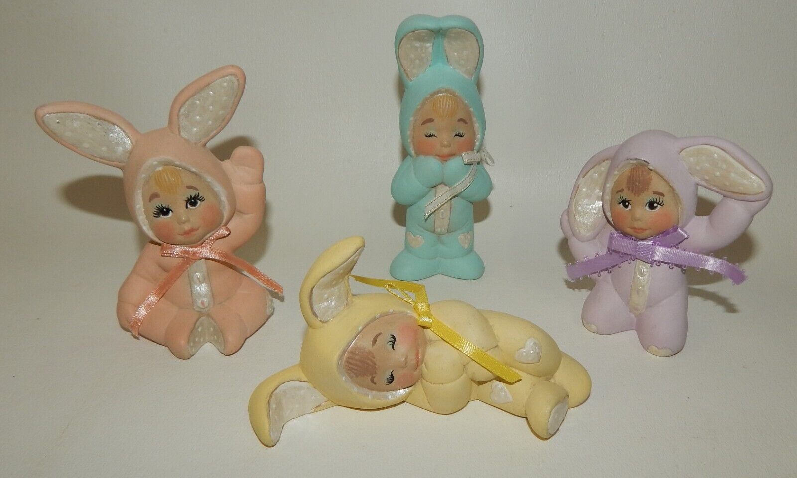 Adorable Set 4 Ceramic Little Babies in Pastel Bunny Suits