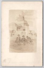 RPPC Double Exposure Handsome Men Laying on Lawn Monument Postcard D26 picture