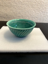 A vintage Chinese green porcelain bowl with waves around the side picture