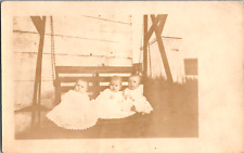 Vintage C. 1907 RPPC Triplets Toddlers Babies Sit Porch Swing Outhouse Postcard picture