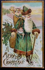 Green Robe Santa Claus in Snow~with Toys~Doll~Antique ~Christmas Postcard~k162 picture