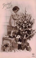 RPPC Christmas Little Girl Decorates Tree Stuffed Animal Toys Vintage Postcard picture