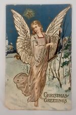 Christmas Post Card S P Co Printed in Germany Embossed Angel & Harp Snowy Night picture
