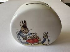 White ceramic coin bank with bunny rabbit family illustration print German picture