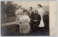 Antique RPPC Postcard~ Family With Barns & Farm In the Background picture