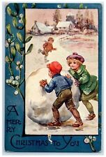 Christmas Children Playing Giant Snowball Winter Scene Mistletoe Posted Postcard picture