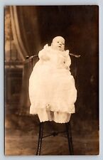RPPC Infant Boy Wears White Gown in Chair AZO 1918-1930 VTG Postcard 1531 picture