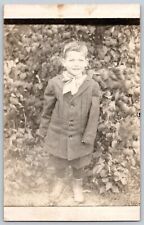 RPPC Postcard~ Young Boy In Oversized Clothes With A Large Bow Tie picture