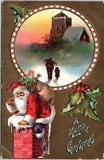 c1915 MERRY CHRISTMAS SANTA CLAUS GOING DOWN CHIMNEY EMBOSSED POSTCARD 41-154 picture
