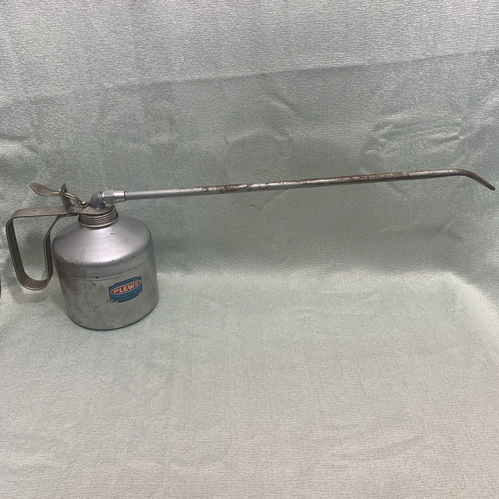 Vintage Plews Gem thumb pump oil can manufactured in the USA.