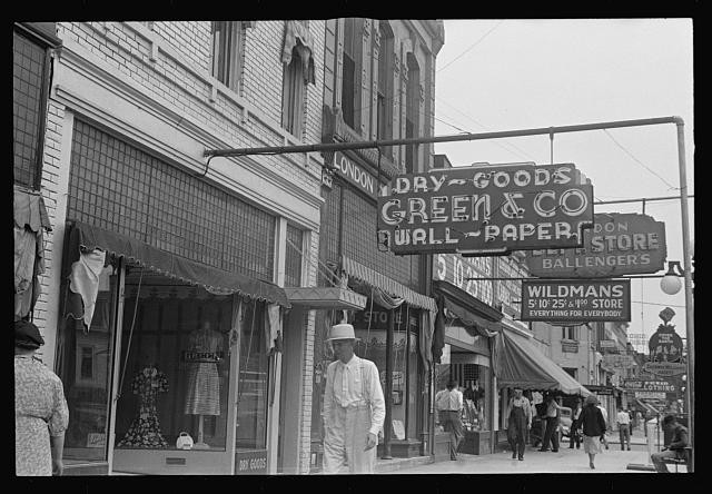 Photo:1930s Downtown Storefronts Dry Goods Wall Paper Signs Street Scene