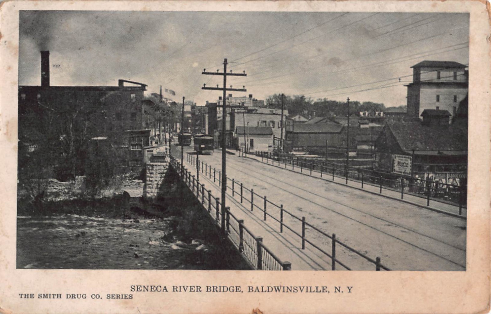 1909 PC-The Seneca River Bridge Leading to Businesses, Baldwinsville, New York