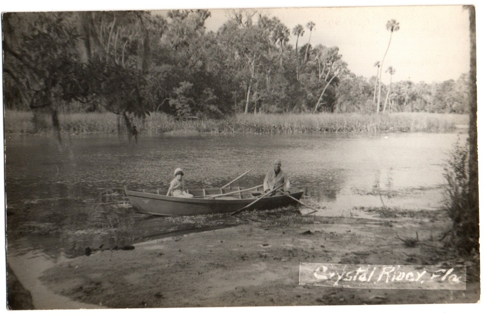 Crystal River, FL Florida old RPPC Postcard, Couple in a Boat