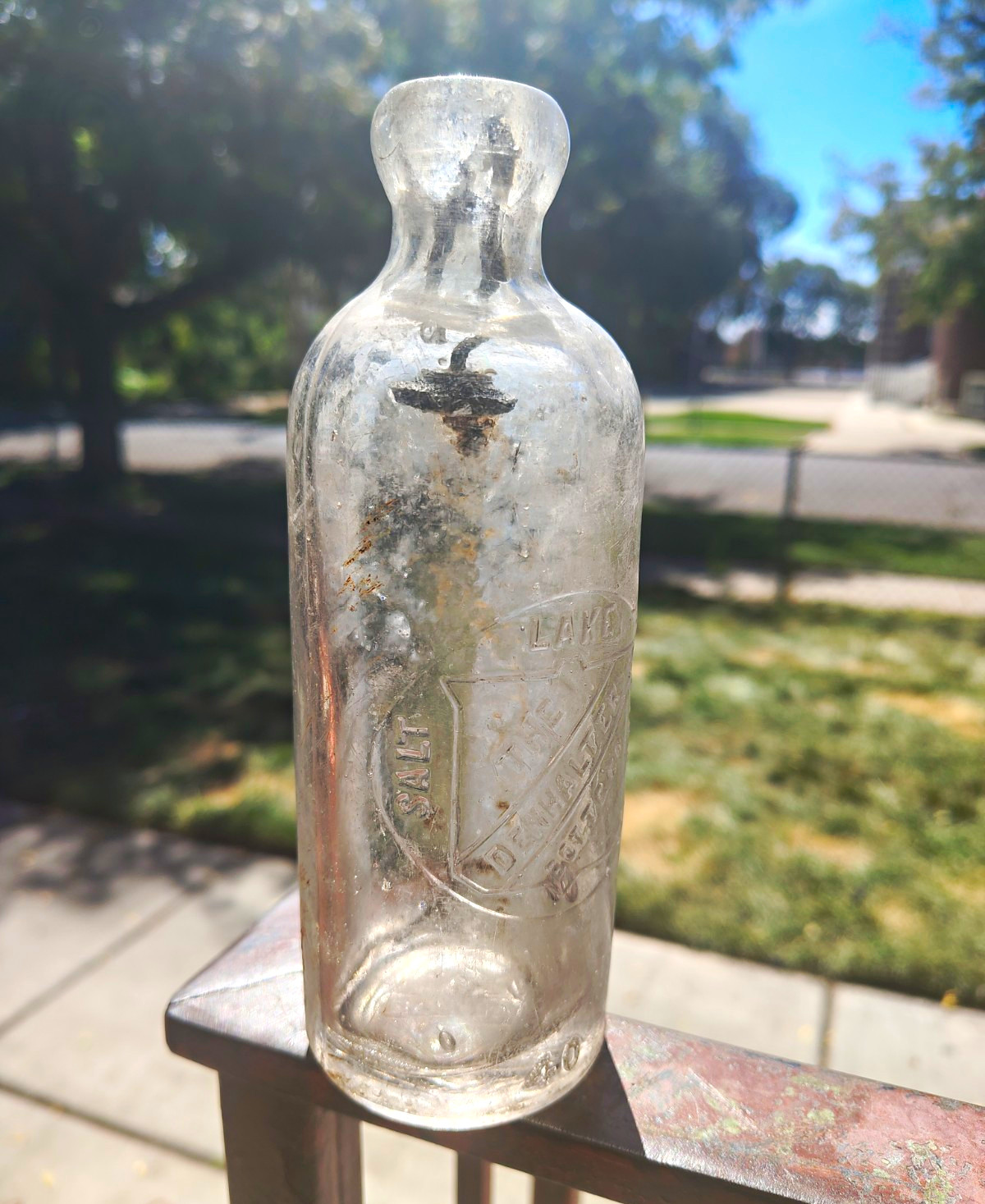 Vintage Clear Glass Bottle with Embossed Design, Unlabeled / No Brand Mark