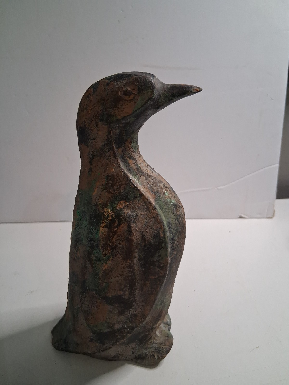 1930-1950 (Mcm) Vintage mid-century cast iron or metal-painted penguin.